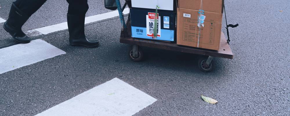 Tenant moving out of apartment with boxes and checklist, symbolizing the importance of documentation for Ohio security deposits