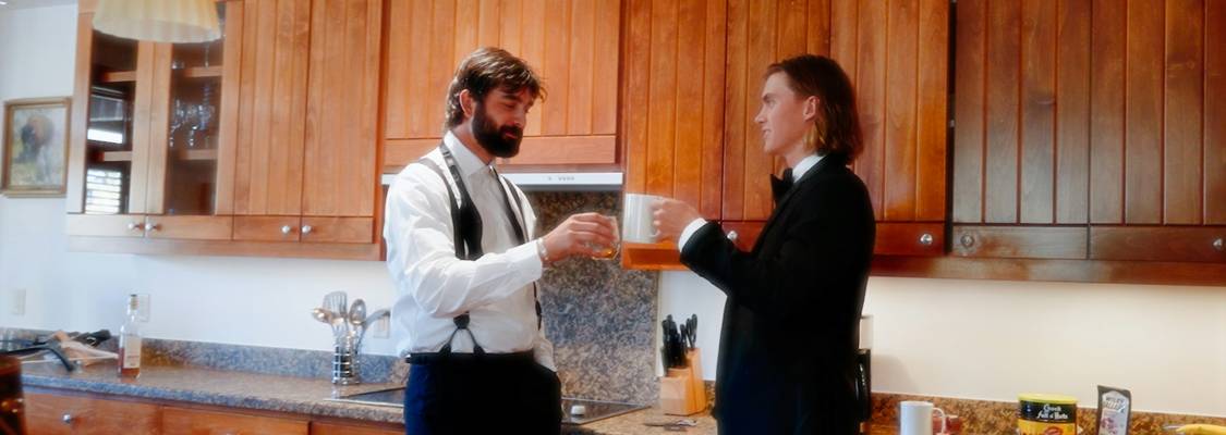 Landlord and tenant conducting a move-out inspection together in an Ohio apartment, reviewing a checklist and documenting the unit's condition