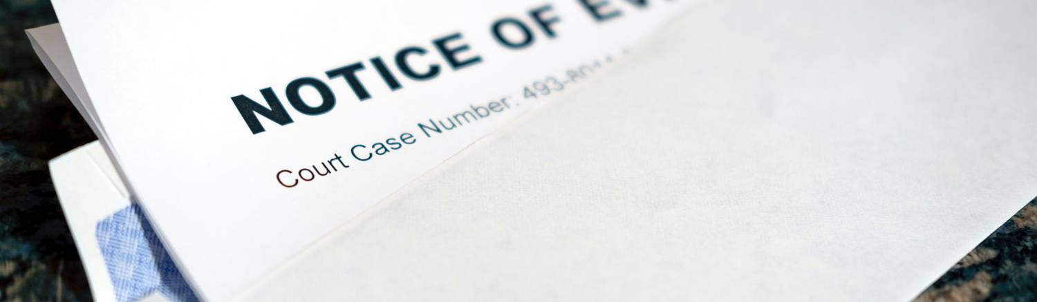 Eviction notice taped to an apartment door in Ohio, symbolizing the start of the legal eviction process for tenants