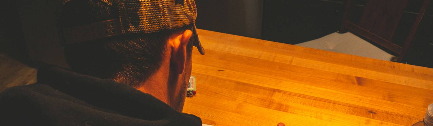 Tenant writing a letter to landlord in an Ohio apartment, with rental paperwork visible on a desk