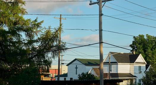 Tenant on phone after water or electric shut off in Ohio rental, symbolizing illegal utility shutoff situations